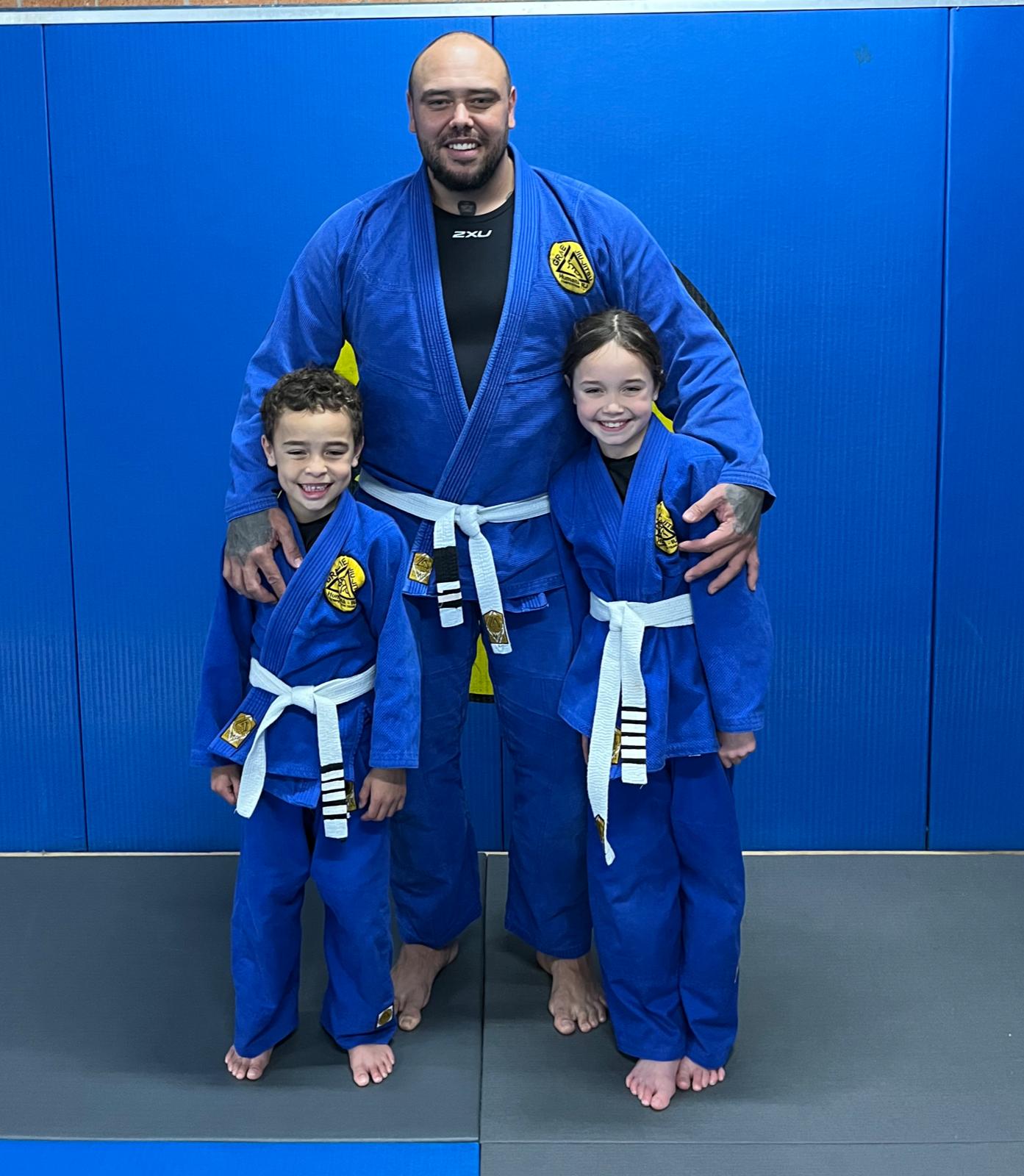 Father and kids in Jiu jitsu